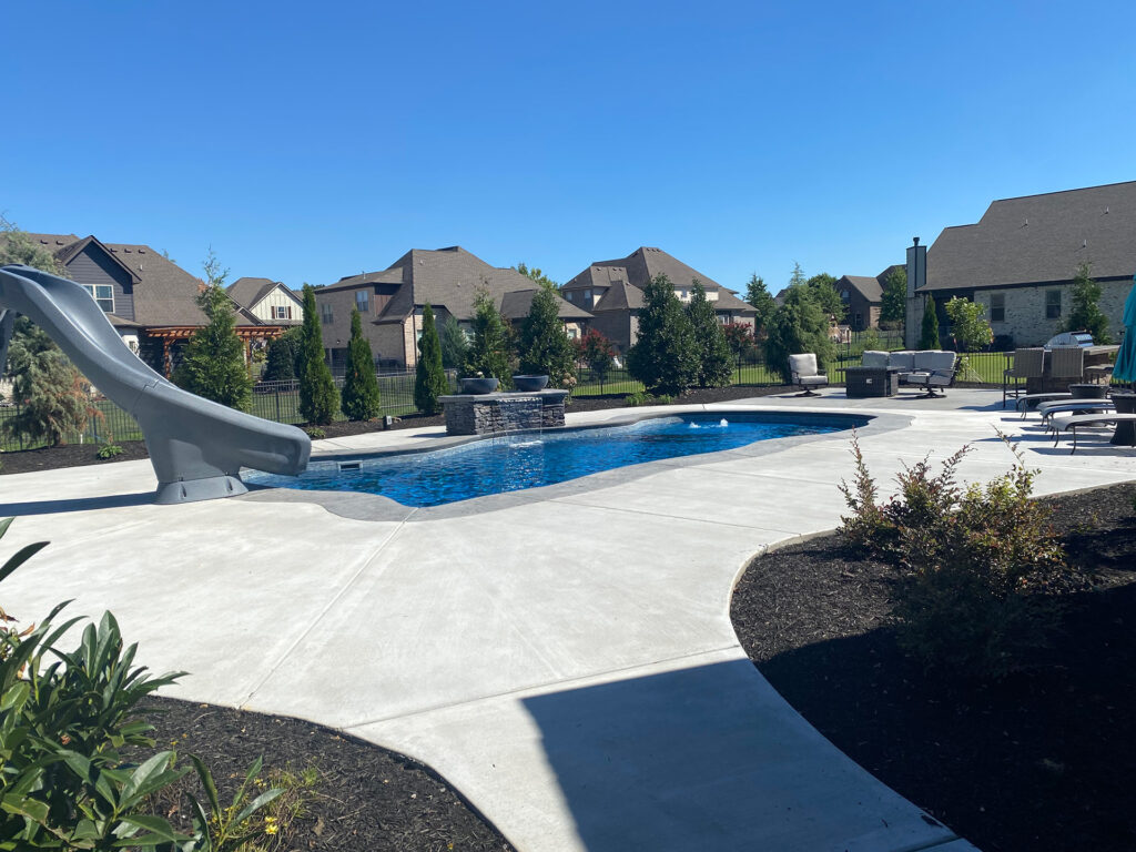 The Billabong Cove pool shape installed with slide